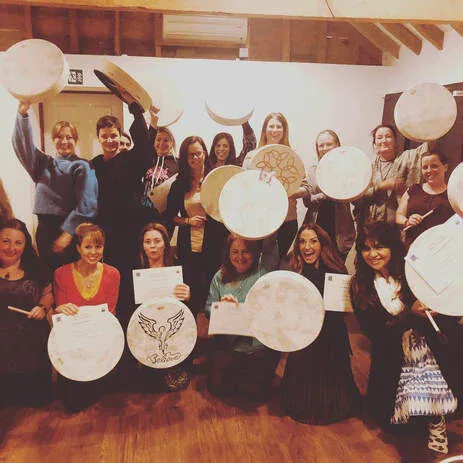 Group of people at a Reiki workshop with certificates